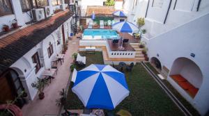 an overhead view of a courtyard with an umbrella at Old Courtyard Hotel in Cochin