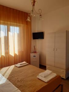 Letto o letti in una camera di Le Quattro Isole