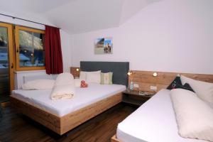 מיטה או מיטות בחדר ב-Freihaushof