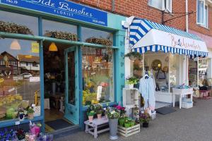 a store front of a store with flowers and plants at The Garden Room in Chichester
