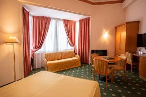Postel nebo postele na pokoji v ubytování Hotel Estense