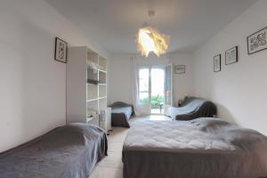 Katil atau katil-katil dalam bilik di CAPO BIANCO - Cap Corse et Vue Mer