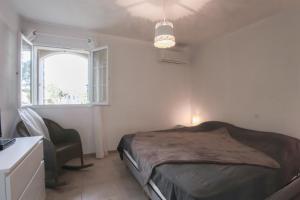 A bed or beds in a room at CAPO BIANCO - Cap Corse et Vue Mer