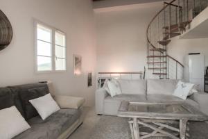 A seating area at CAPO BIANCO - Cap Corse et Vue Mer
