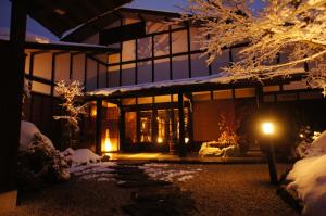 a house at night with snow on the ground at Hidaji (Adult Only) in Takayama