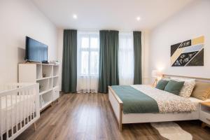 Postel nebo postele na pokoji v ubytování FAMILY Apartment OSTRAVA