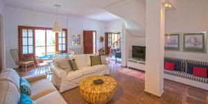 a living room with a couch and a table at Willow Sea View Villa, Kriopigi in Kriopigi