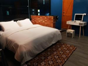 Postel nebo postele na pokoji v ubytování Fangliao Chun Lai Homestay + 37 fotografií