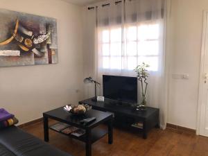 TV a/nebo společenská místnost v ubytování Casa Cesar