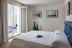 Łóżko lub łóżka w pokoju w obiekcie Villa Frida by HMZ Villas