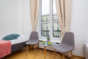 Postel nebo postele na pokoji v ubytování Apartments Warsaw Warecka by Noclegi Renters