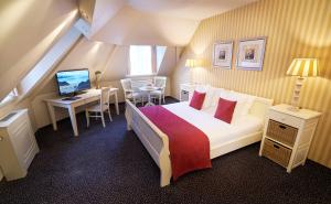 Postel nebo postele na pokoji v ubytování Amrâth Hotel Lapershoek Arenapark