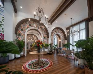 a lobby with a table with flowers on it at La casita Hua-Hin seaview by Yaya in Hua Hin +36 photos