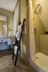 a bathroom with a towel rack and a shower at The Gallery Studios in Porto +75 photos