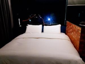 Voodi või voodid majutusasutuse Fangliao Chun Lai Homestay toas