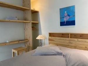 Ένα ή περισσότερα κρεβάτια σε δωμάτιο στο Secret de Jardin New
