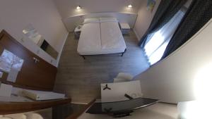 Katil atau katil-katil dalam bilik di Hotel Alberello