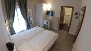 Katil atau katil-katil dalam bilik di Hotel Alberello