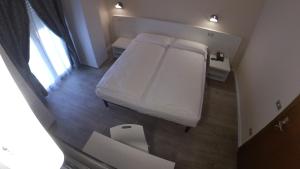 Katil atau katil-katil dalam bilik di Hotel Alberello