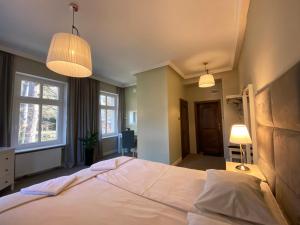 Posteľ alebo postele v izbe v ubytovaní CIENISTA 7 APARTMENTS