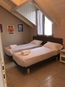 Postel nebo postele na pokoji v ubytování B&B Leonardo