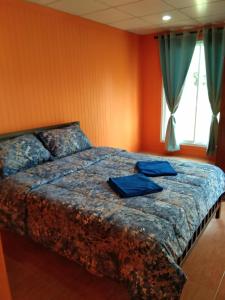 Postel nebo postele na pokoji v ubytování Baan Gebsup บ้านเก็บทรัพย์