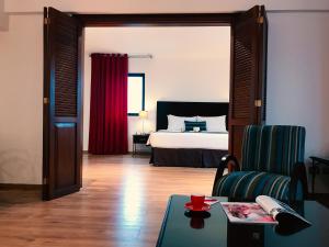 Postel nebo postele na pokoji v ubytování El Polo Apart Hotel & Suites