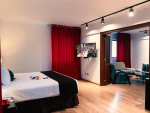Postel nebo postele na pokoji v ubytování El Polo Apart Hotel & Suites