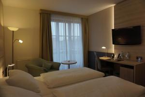 Postel nebo postele na pokoji v ubytování Hotel Kastanienhof