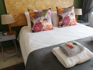 Ένα ή περισσότερα κρεβάτια σε δωμάτιο στο LemonBlossom