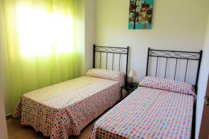 Ένα ή περισσότερα κρεβάτια σε δωμάτιο στο Apartamento en playa Canet de Berenguer