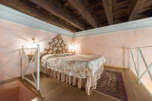 En eller flere senge i et værelse på Corte Dei Neri