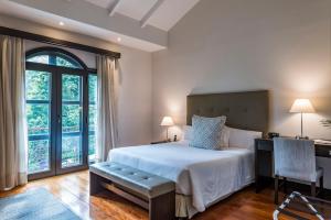 Кровать или кровати в номере Movich Casa del Alferez