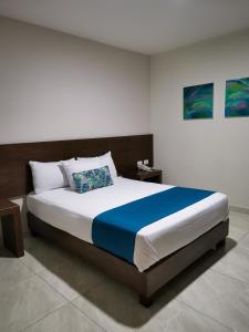 Ένα ή περισσότερα κρεβάτια σε δωμάτιο στο Hotel Pabela