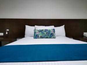 Ένα ή περισσότερα κρεβάτια σε δωμάτιο στο Hotel Pabela