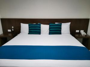Ένα ή περισσότερα κρεβάτια σε δωμάτιο στο Hotel Pabela