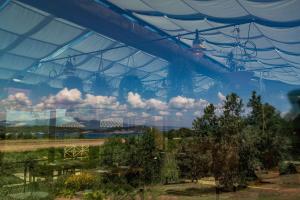 a greenhouse with a view of a garden with trees at Torre di Baratti Bio Resort in Populonia