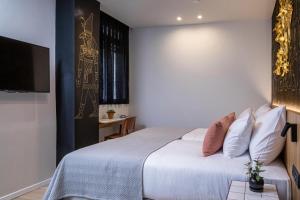 Postel nebo postele na pokoji v ubytování Artist Hotel - an Atlas Boutique Hotel