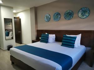 Ένα ή περισσότερα κρεβάτια σε δωμάτιο στο Hotel Pabela
