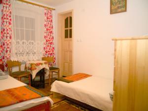 Łóżko lub łóżka w pokoju w obiekcie Pod kasztanem gospodarstwo agroturystyczne