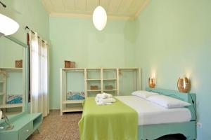 Postel nebo postele na pokoji v ubytování Aria di Rodi