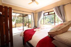 Postelja oz. postelje v sobi nastanitve MALI Boutique Lodge & Tube 'n Axe Budget Accommodation