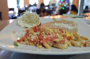 a plate of food on a table with a plate of food at Coral Island Beach View Hotel in Mazatlán