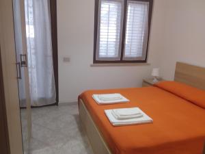 A bed or beds in a room at fabrizio e caterina