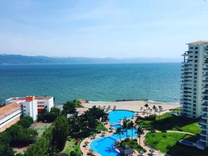 an aerial view of a resort and the ocean at Shangri La Luxury Penthouse Condominiums by Cheap Getaway in Puerto Vallarta