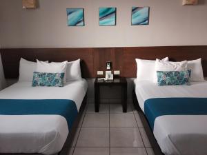 Ένα ή περισσότερα κρεβάτια σε δωμάτιο στο Hotel Pabela