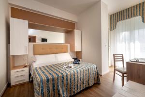Ένα ή περισσότερα κρεβάτια σε δωμάτιο στο Hotel Sole Mio