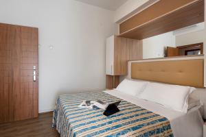 A bed or beds in a room at Hotel Sole Mio