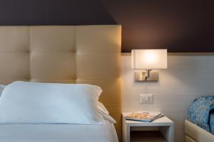 A bed or beds in a room at Hotel Sole Mio