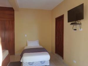 Un pat sau paturi într-o cameră la Hotel Soberao